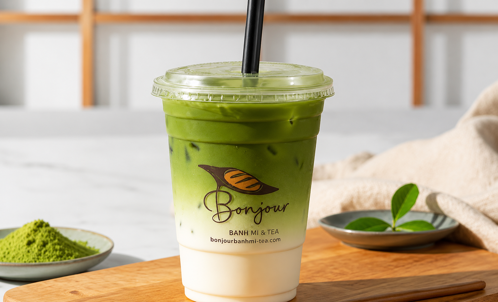 Matcha Latte made with premium Japanese matcha and creamy oat milk in a clear iced cup.